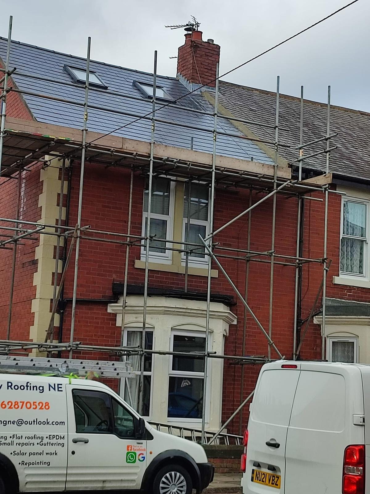 scaffolded terrace re-roof with branded van out front