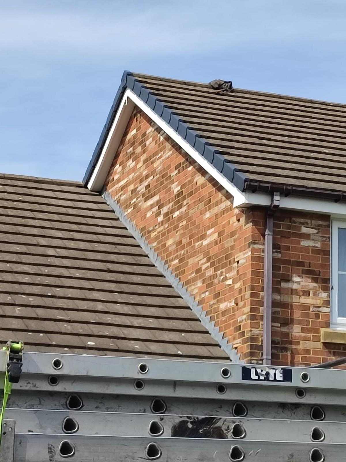 crisp new verge and white fascia on tiled gable