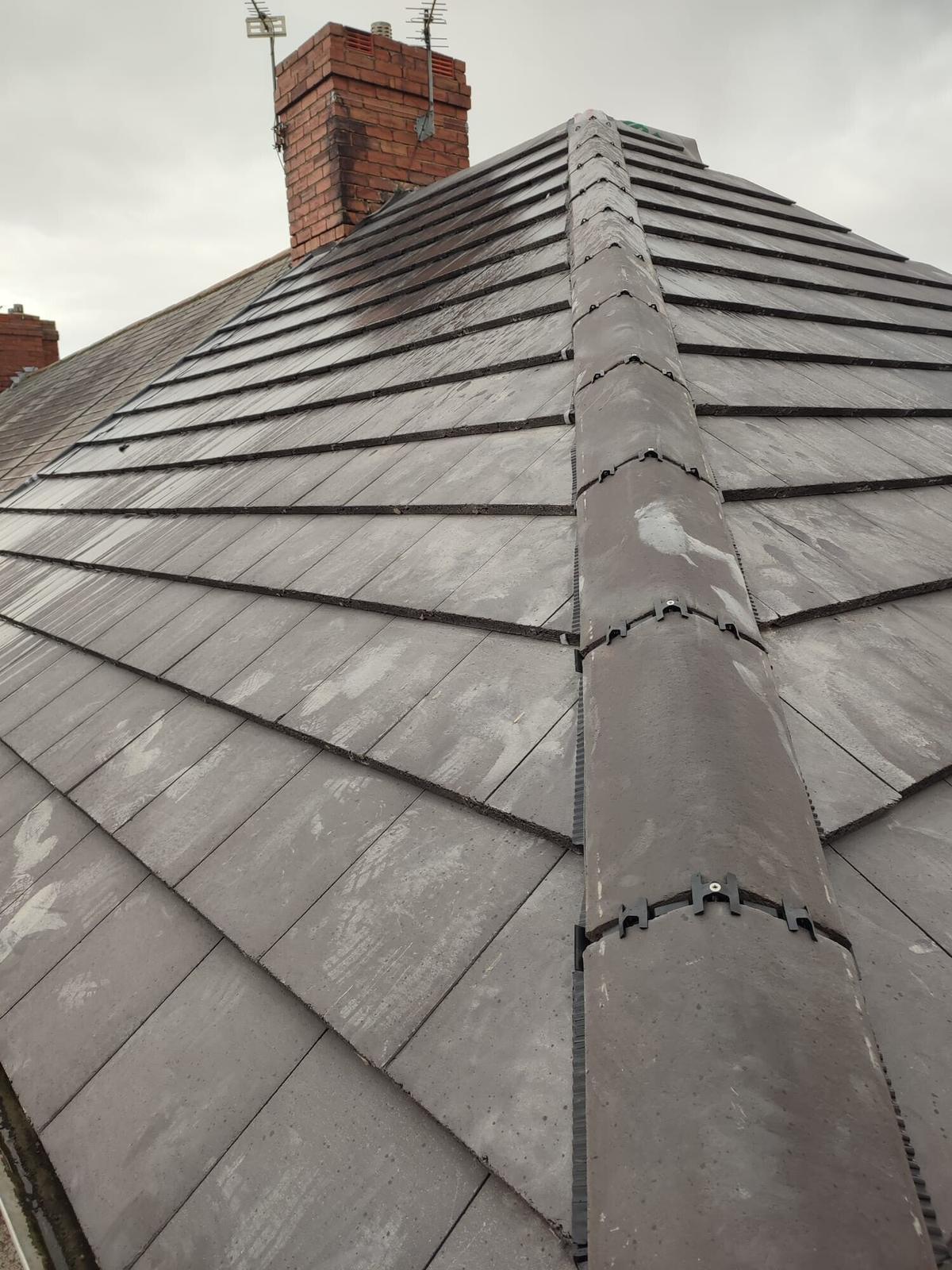 slate hip roof with tight, even hip lines