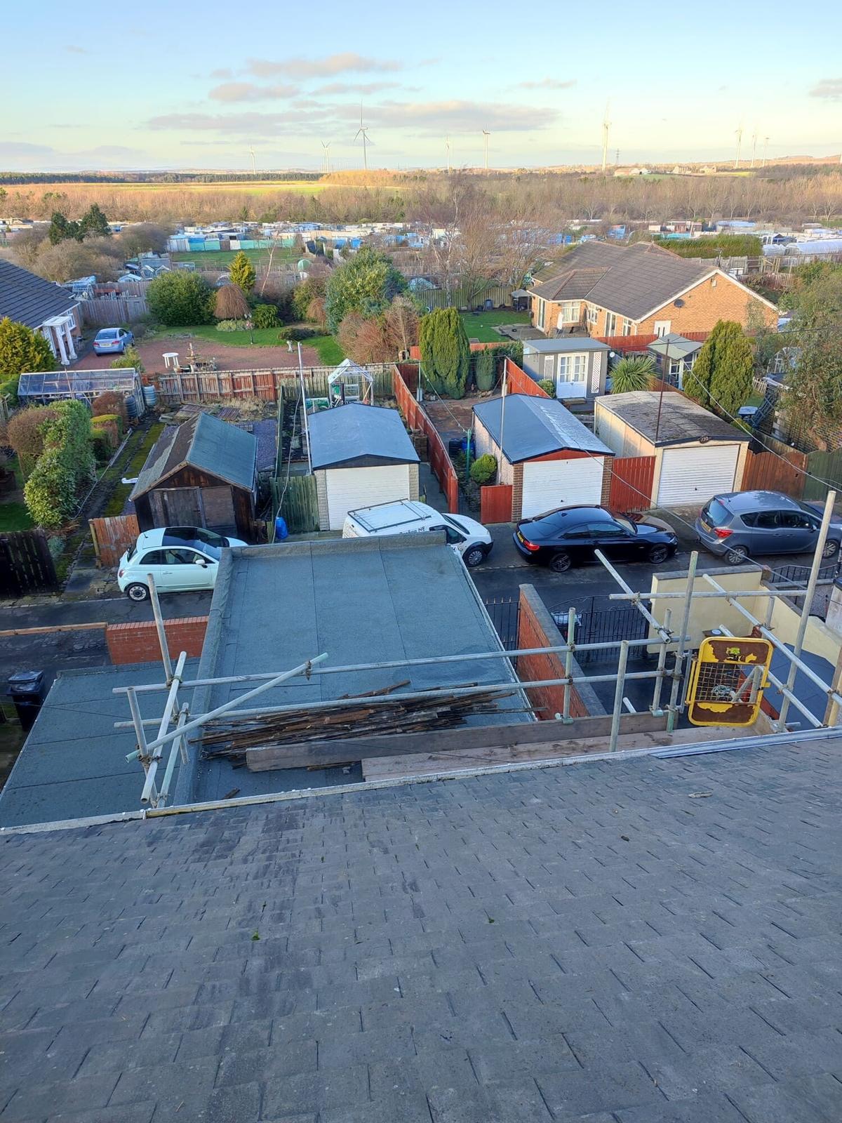 aerial row of re-felted garage flat roofs