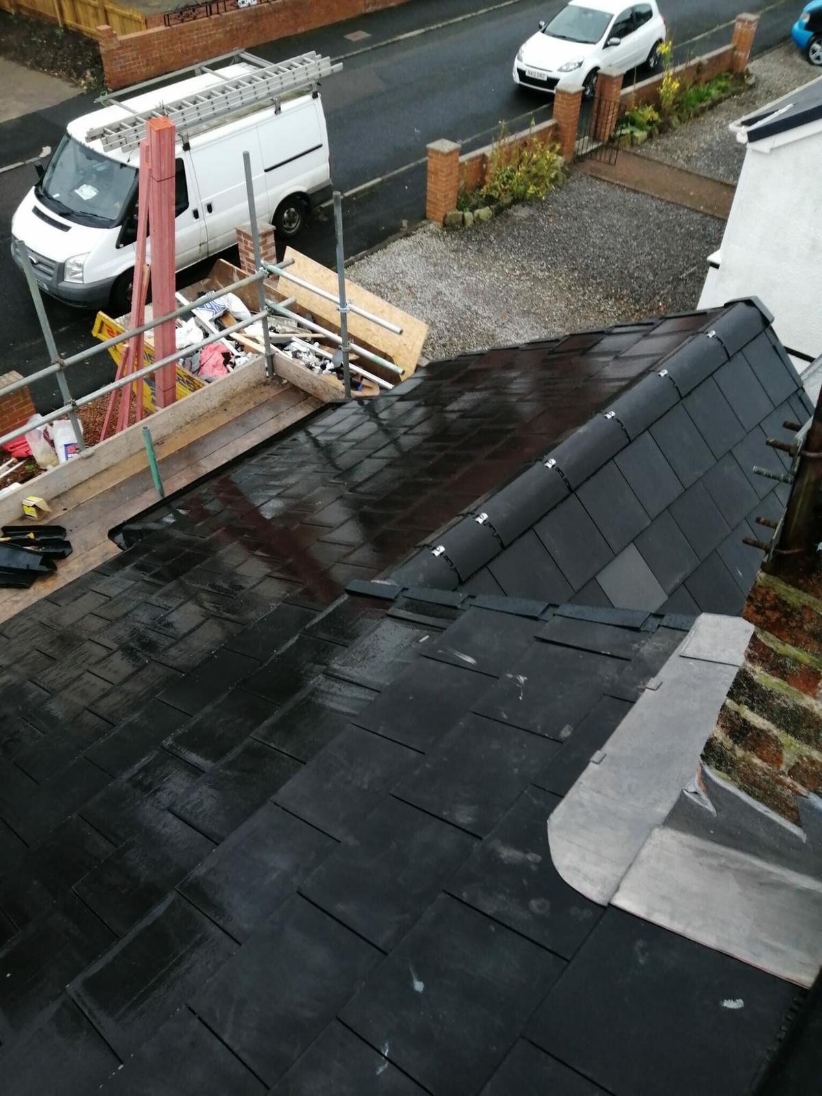 wet slate roof with new lead valley