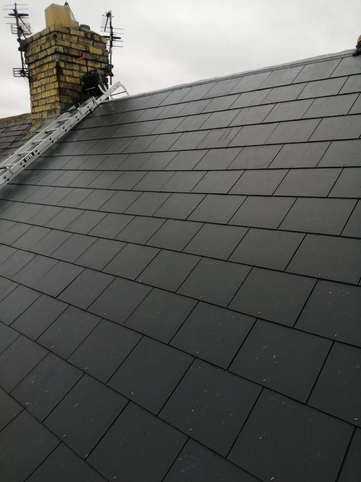 dark slate roof and repointed chimney stack