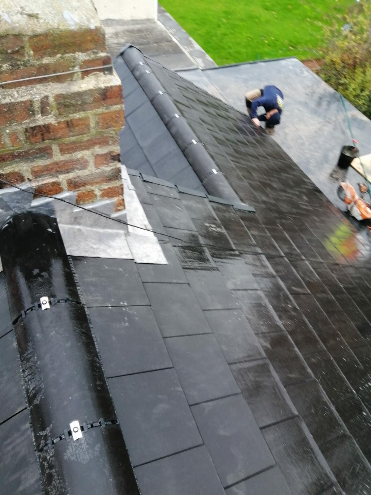 wet slate with fresh lead detail at chimney