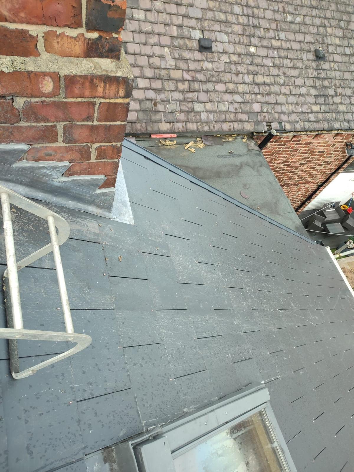 slate roof and brick chimney with new flashings