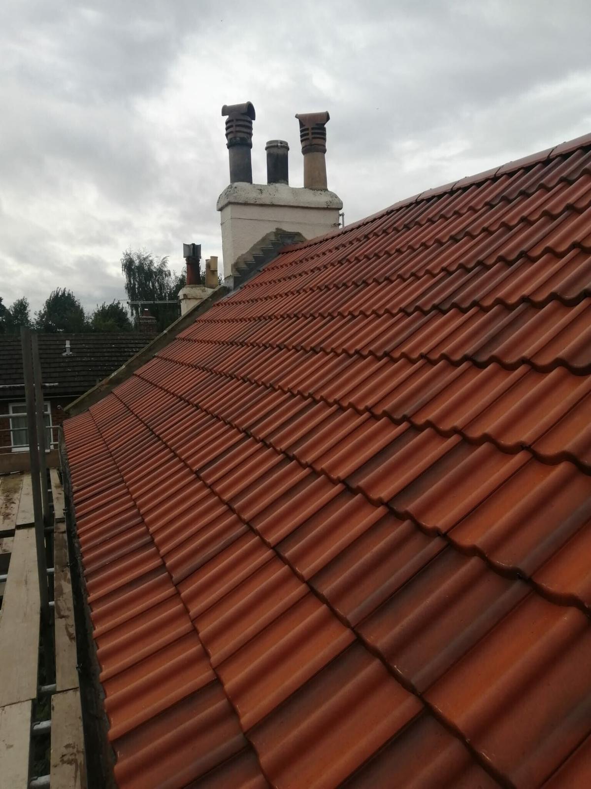 red pantile roof and tall twin-pot chimney, new lead