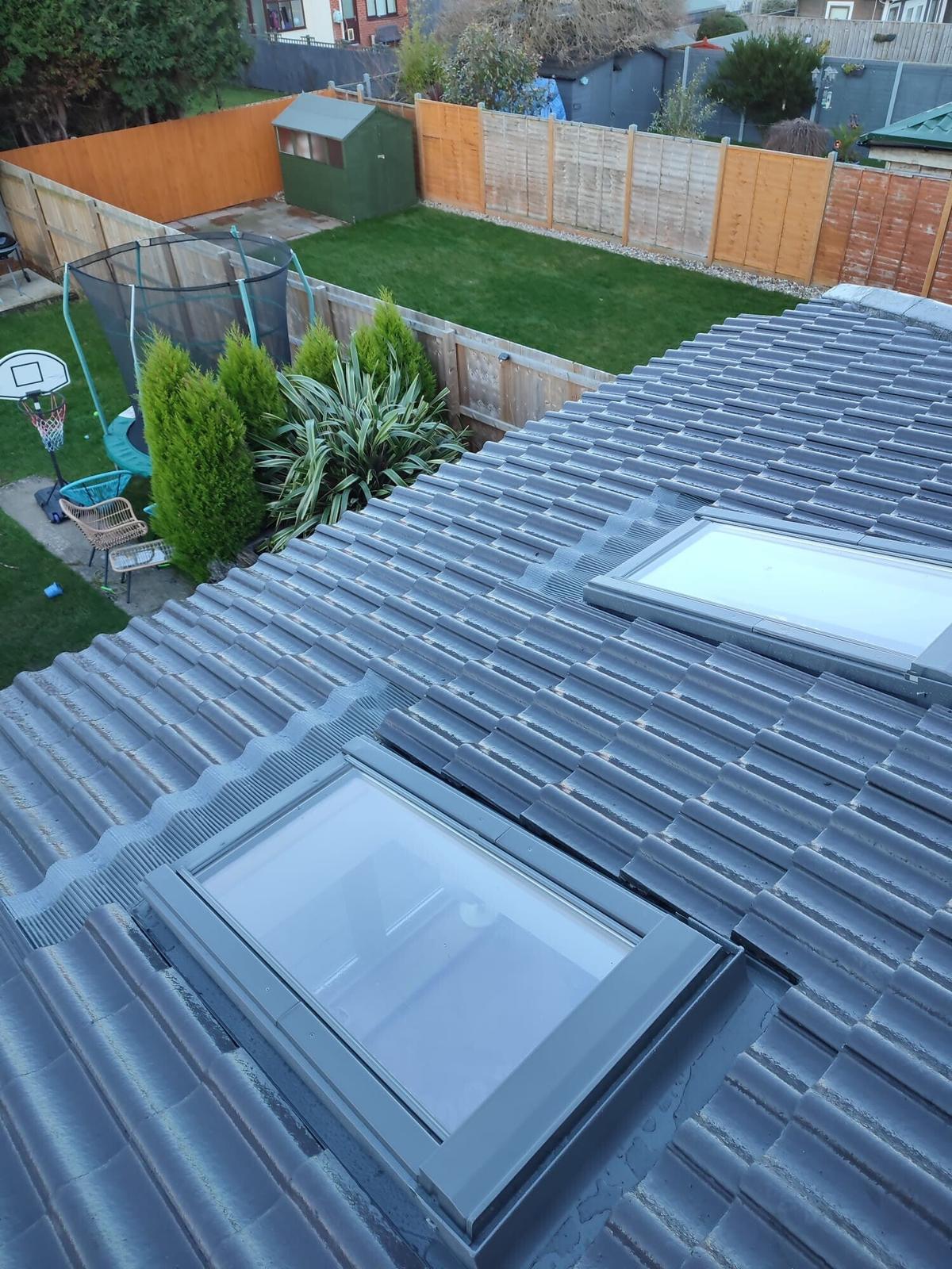 new grey tile roof with velux over rear garden — recent Willow Roofing work