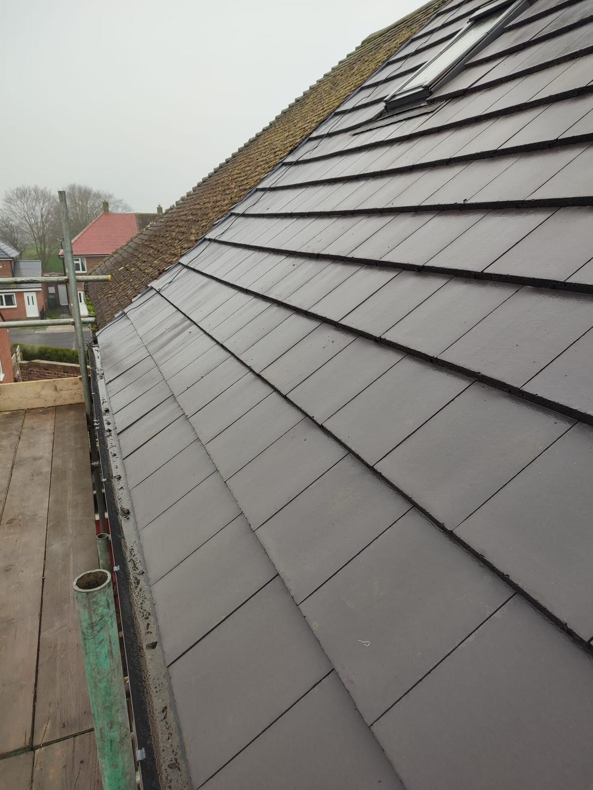 dark plain-tile slope, terrace backdrop — recent Willow Roofing work