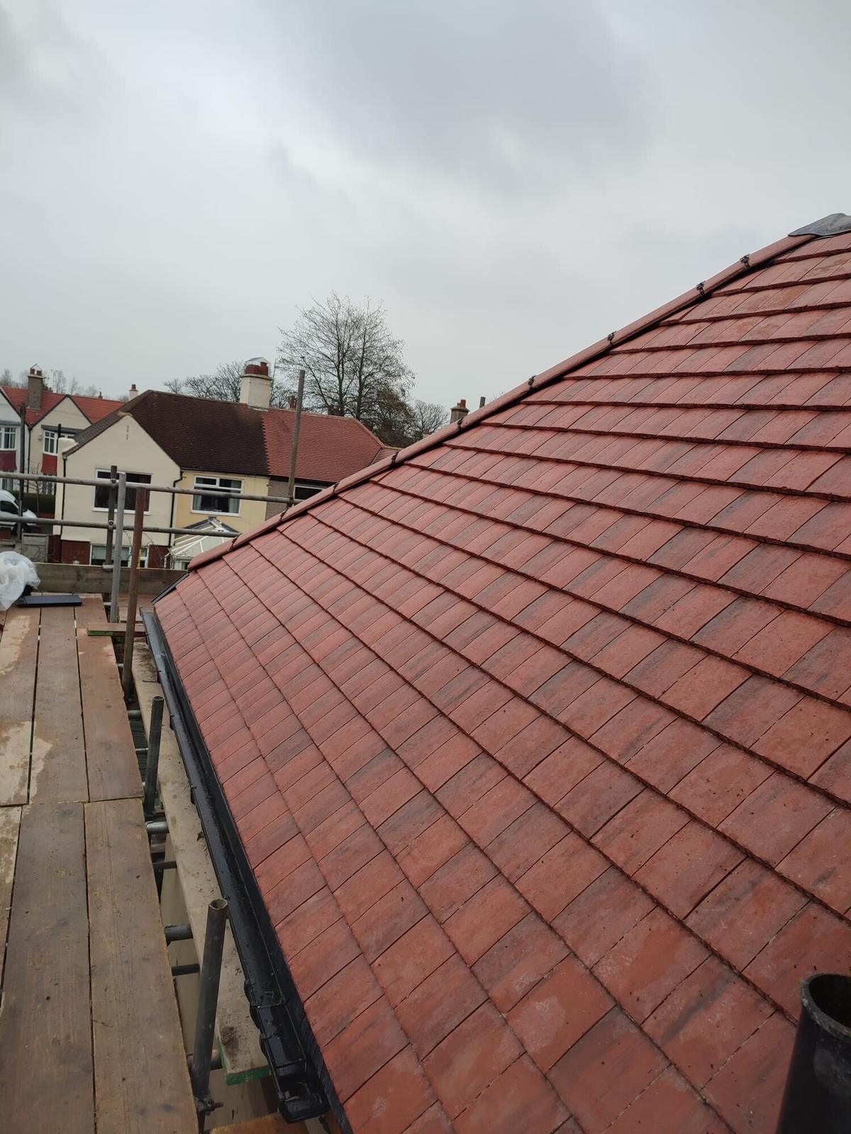 red plain-tile roof from scaffold, terrace