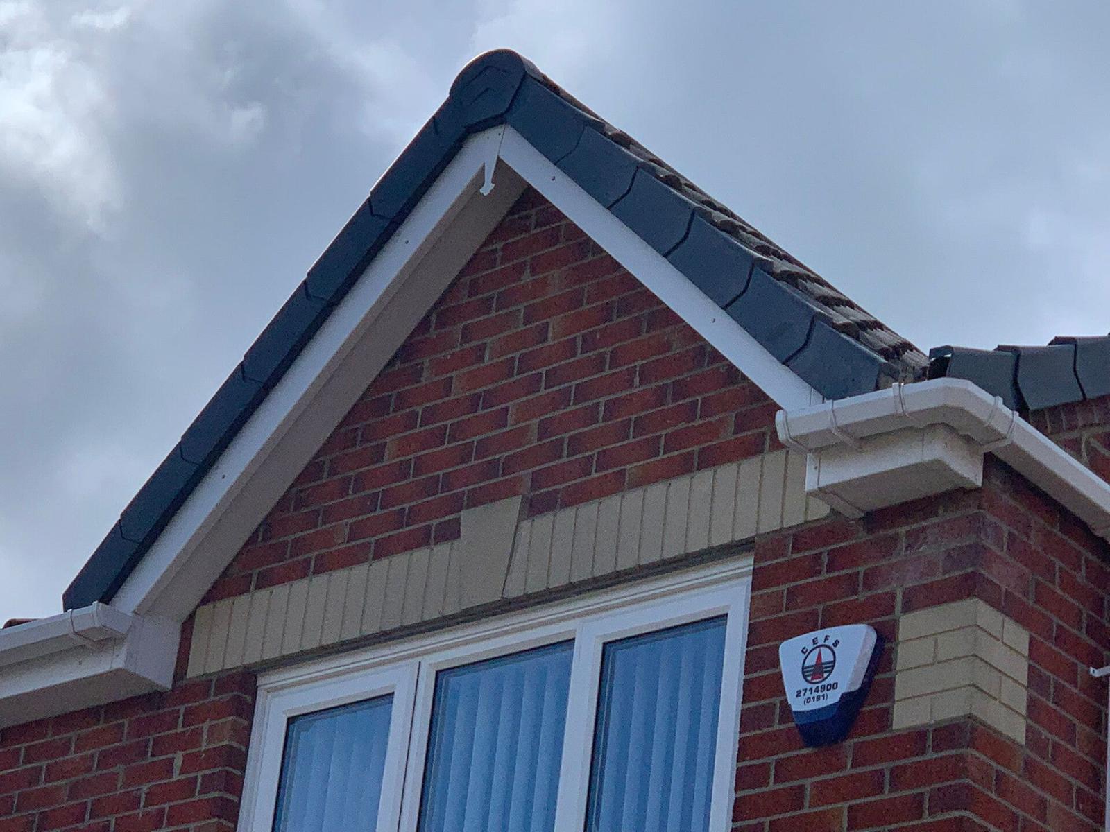 bungalow gable, new dark fascia and tile roof