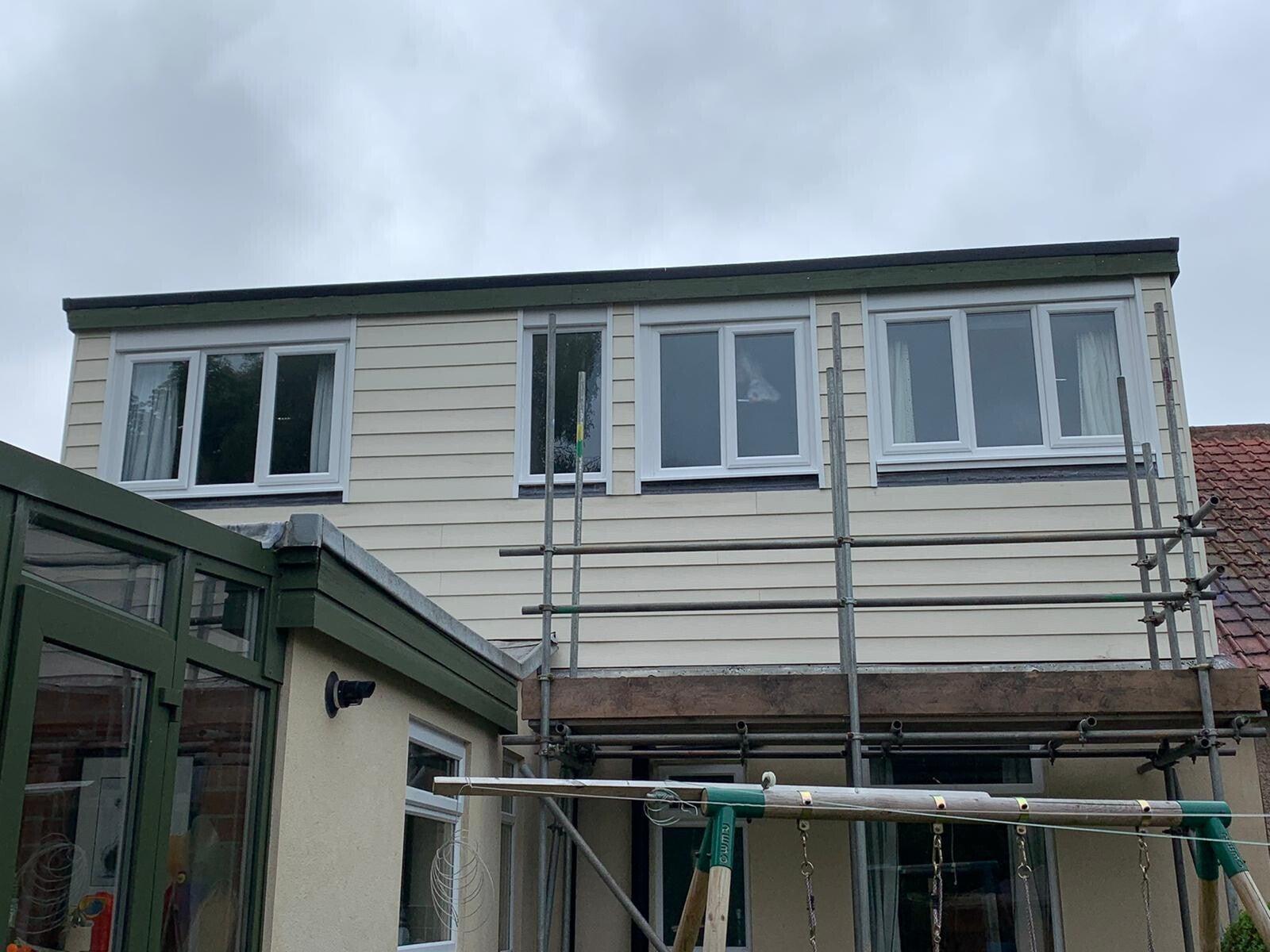 white-clad dormer with new fascia line